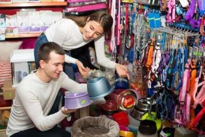 two people looking for pet accessories